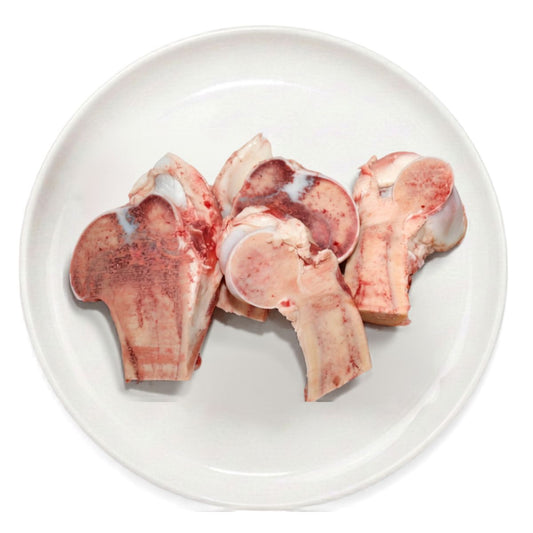 Fresh raw cut marrow bones on a plate, raw dog food, Burleigh Bones Burleigh Heads.