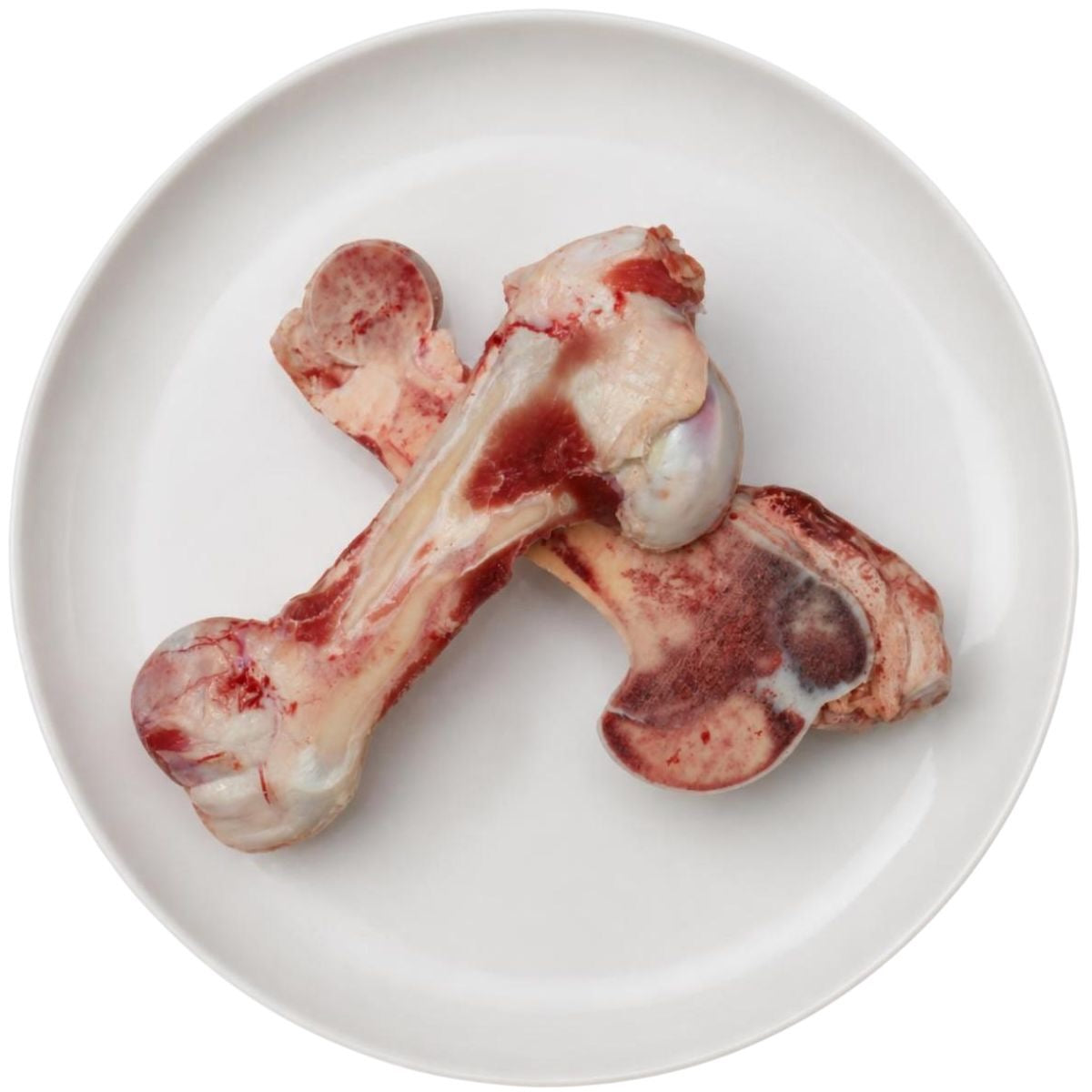Raw half split marrow bones on a plate, raw dog food, Burleigh Bones Burleigh Heads.