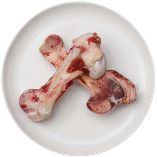 Raw half split marrow bones on a plate, raw dog food, Burleigh Bones Burleigh Heads.